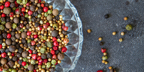 pepper peppercorn 5 spices red, black, green and white pepper, coriander food spice on the table copy space food background 