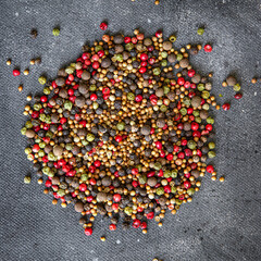 pepper peppercorn 5 spices red, black, green and white pepper, coriander food spice on the table copy space food background 