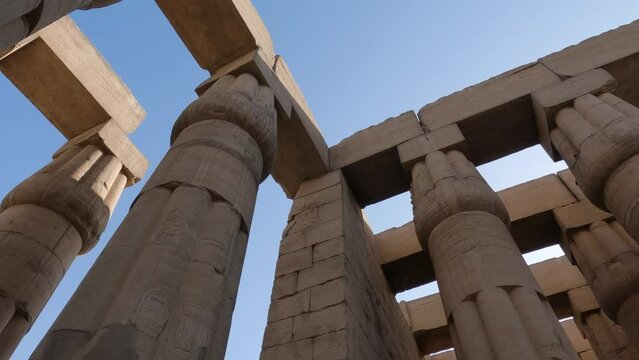 Hand-held Shot Looking Upwards At The Towering Pillars Of The Luxor Temple, Egypt