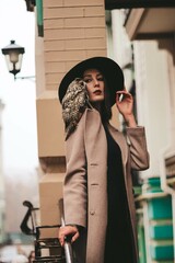 very beautiful girl in a hat with an owl