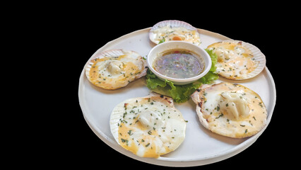 Isolated Baked Scallops with Cheese and Dipping on black background.