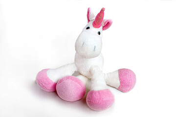 Lovely white pony doll isolated on white background. Adorable teddy bear for decorative. High quality photo