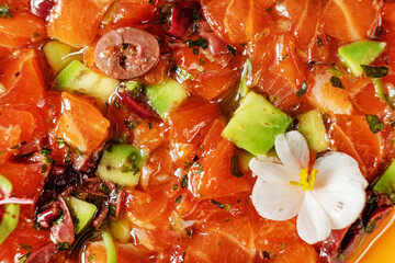 salmon tartar with avocado and herbs