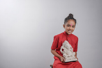 Little Indian child with lord ganesha