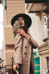 very beautiful girl in a hat with an owl