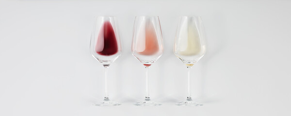 Flat-lay of red, rose and white wine in glasses on white background, banner