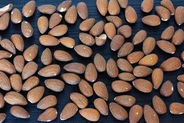 delicious almonds on a dark background