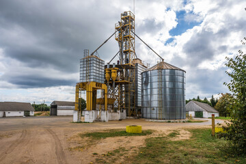 agro silos granary elevator with seeds cleaning line on agro-processing manufacturing plant for processing drying cleaning and storage of agricultural products © hiv360