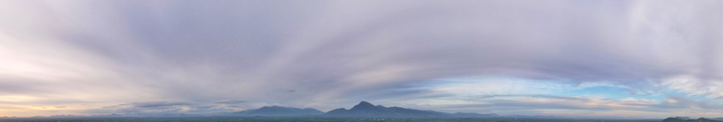 Panorama dramatic beautiful clouds in sunset with mountain, Panoramic landscape, wallpaper background.