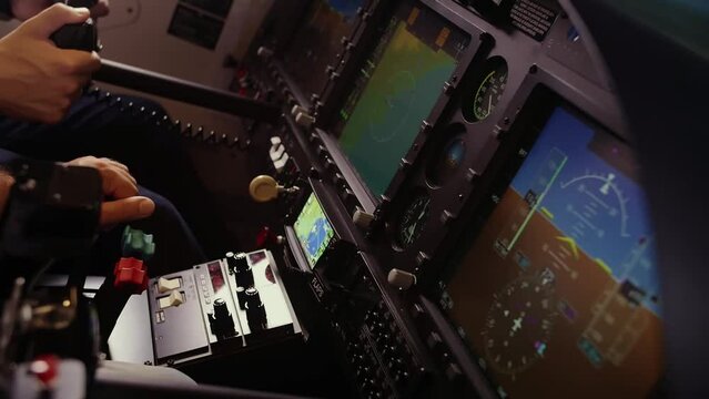Two Pilot's in flight simulator with his hands on the steering wheel. The flight of the plane from the cockpit.Slow Motion