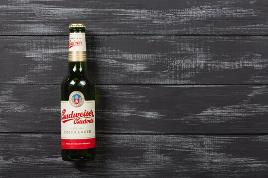 Budweiser Budvar beer bottle on a wooden background with copy space