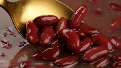 Red kidney beans. Cooking red kidney beans close up. Chef stir beans with spoon