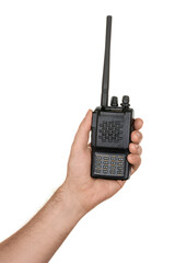 Man's hand holding handheld radio communication device in black color with keyboard and display. Isolated on white background.