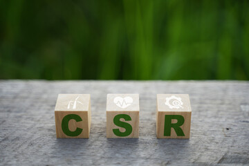 Corporate and community social responsibility give back CSR icon concept on green nature background.