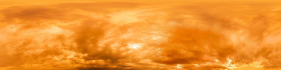 Golden glowing red orange overcast sunset sky panorama. Hdr seamless spherical equirectangular 360...