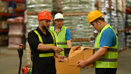 Displeased male manager scolding young intern with bad work results, damaged cardboard box. Stress at work concept