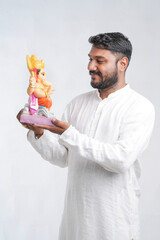 Young Indian man with Lord Ganesha , Celebrating Ganesha festival