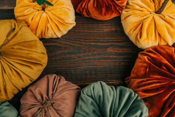 Table with handmade pumpkins made of fabric