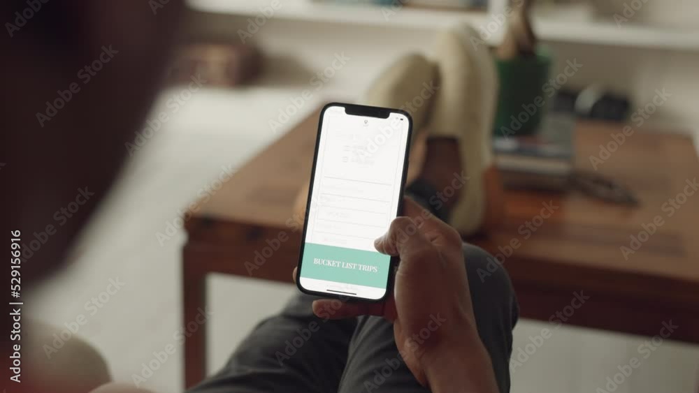 Poster phone, hands and internet with a man using mobile technology to search for a trip idea in his home. 