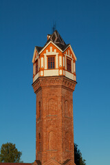 Fototapeta na wymiar Ancient water tower in the center of the city of Staraya Russa in the Novgorod region of Russia