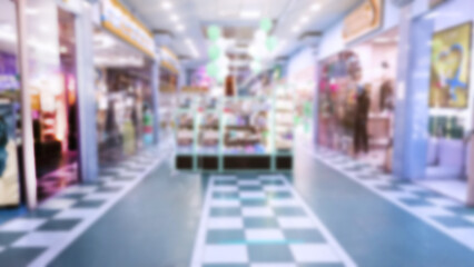 Abstract blur image of empty shopping and entertainment mall background. Hall. Market. Grocery and beauty Store. Retail industry. Discount. Inflation and crisis concept. Aisle. Nobody. Trade show.
