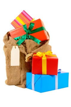 Santa sack full with pile of Christmas gifts isolated