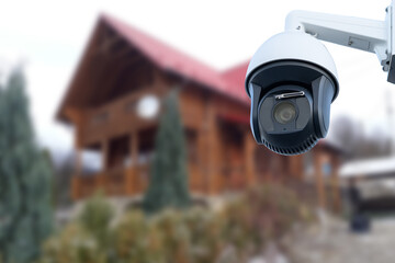 Security camera and private house on the background.