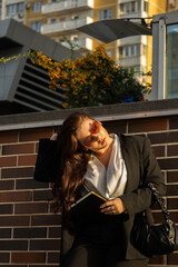 Young businesswoman in a black suit
