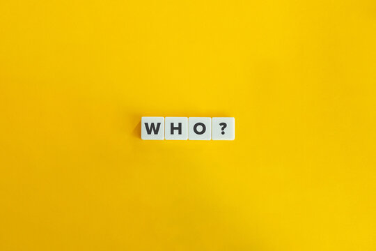 Who Question and Word on Block Letter Tiles on Yellow Background. Minimal Aesthetics.