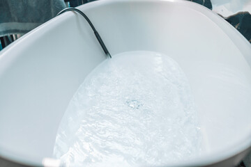 A clean bathtub with hot water