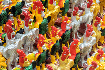 Fototapeta na wymiar A group of colorful poultry statues at Buddhist temple, Thailand.