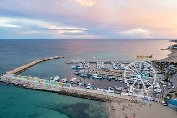 Ferris wheel in the port of Campomarino, on the seafront at sunset 2
