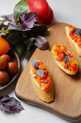 Brushetta, antipasti  or authentic traditional spanish tapas set on wood board. Variety of  pinchos (pintxos) in a bar or restaurant or home party or picnic. 