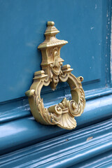 Old door handle on a front door, Opera Avenue in Paris