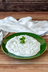Dry tzatziki on wood floor. Snack prepared with yogurt and mint. Traditional Mediterranean cuisine delicacies. Local name kuru cacik or tzatziki. close up