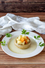 Artichokes with olive oil on wood background. Traditional Mediterranean cuisine delicacies. local name zeytinyagli enginar. Close up