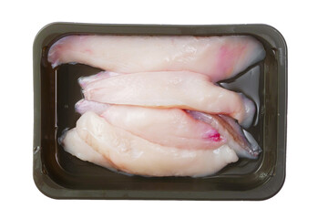 Raw uncooked monk fish portion fillet on a black plastic tray. White isolated background. Top...