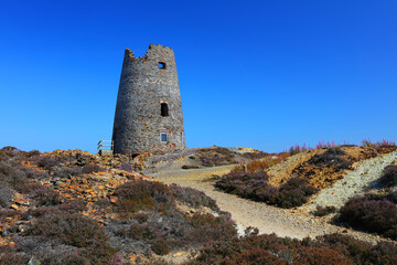 Disused Windmill at Parys Mountain with clear Blue Sky in the background. Anglesey, North Wales, UK.