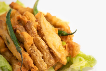 Indian Street Food Sliced Crispy Fried Potato Wedges Also Called Aloo Bhajji, Alu Bajji, Aaloo Pakoda or Pakora Made Of Bengal Gram Flour Besan Coating Are Famous Tea Time Evening Time Appetizer