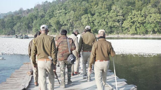  Forest officials patrol in Ram Ganga river close to Jim Corbett national park in India to protect animals from poachers. HQ Apple Prores 60 FPS 4k footage.