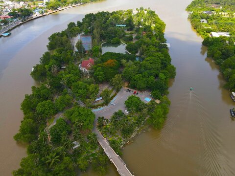Aerial shot of the Ko Lamphu island, Tapi river in Thailand with a cityscape in the background