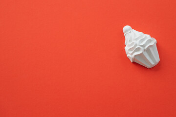 A plaster figure of a cake on a colored background