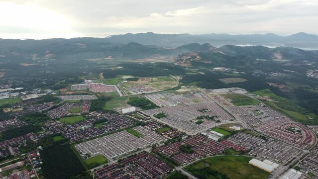 Aerial rotation view residential property community Bandar Tasik Mutiara, Tasek in misty morning