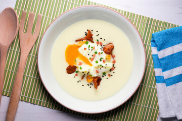 Potato parmentier with poached egg and mushrooms. Traditional Spanish haute cuisine tapas.