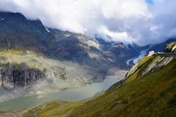 Obraz premium Scenic view of Pasterze Glacier and the lake bellow in Glockner Group of the High Tauern mountain range in Carinthia, Austria at Grossglockner high alpine road