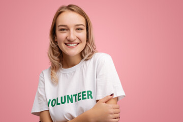 Happy young volunteer looking at camera