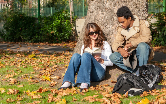 Teenage Students: Book Club. College Friends Discussing A Book Together. From A Series Of High School Student Related Images.