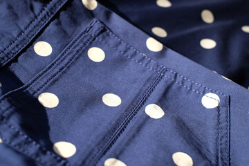 Blue cotton polka dots fabric with snlight, skirt details