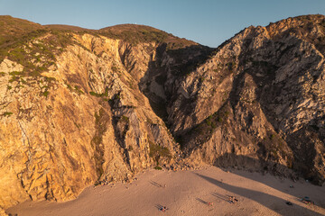 Fototapeta na wymiar Mountains near sandy beach in morning
