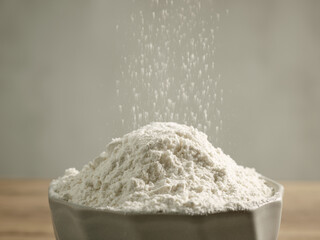 flour pouring into bowl